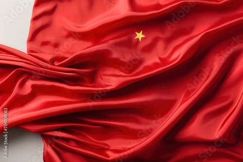 Red Chinese flag made of silk with a gold star
