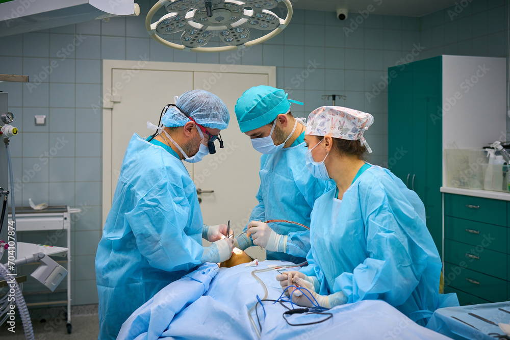 Plastic surgeons work in the operating room Plastic surgeons work in the operating room