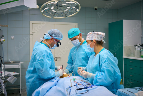 Plastic surgeons work in the operating room
