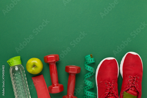 Sport equipment with tape measure on color background, top, view. Weight loss concept