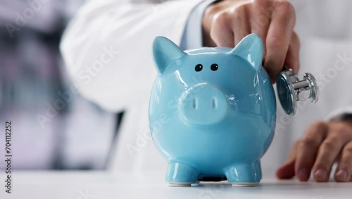 Doctor Health Checking Piggy Bank photo