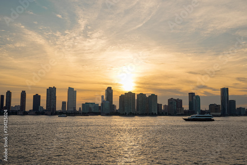 sunset on a boat trip with a city s skyline and beautiful colours in the sk