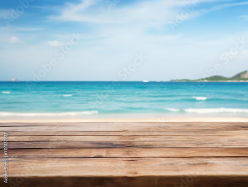 An empty wooden table with the sea in the background