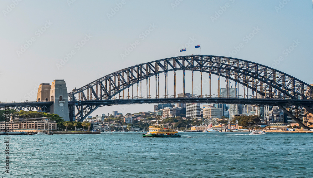 The Sydney Harbor Bridge is a heritage-listed steel through arch bridge,  nicknamed The Coathanger because of its arch-based design and carries rail, vehicular, bicycle and pedestrian. Australia, 2019