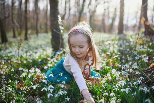 Five year old girl playing egg hunt on Easter