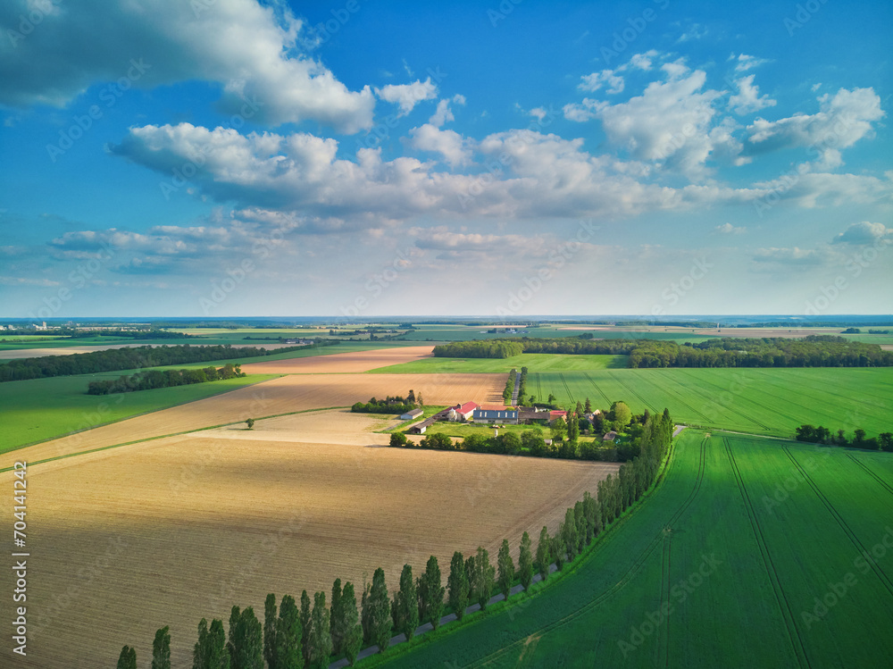 Aerial drone view of green fields and meadows in Yveliness,, near Paris, France