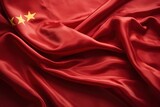 Red Chinese flag made of silk with five gold stars