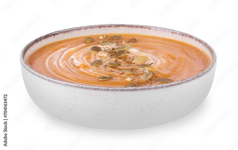 Tasty pumpkin soup with seeds and cream in bowl isolated on white