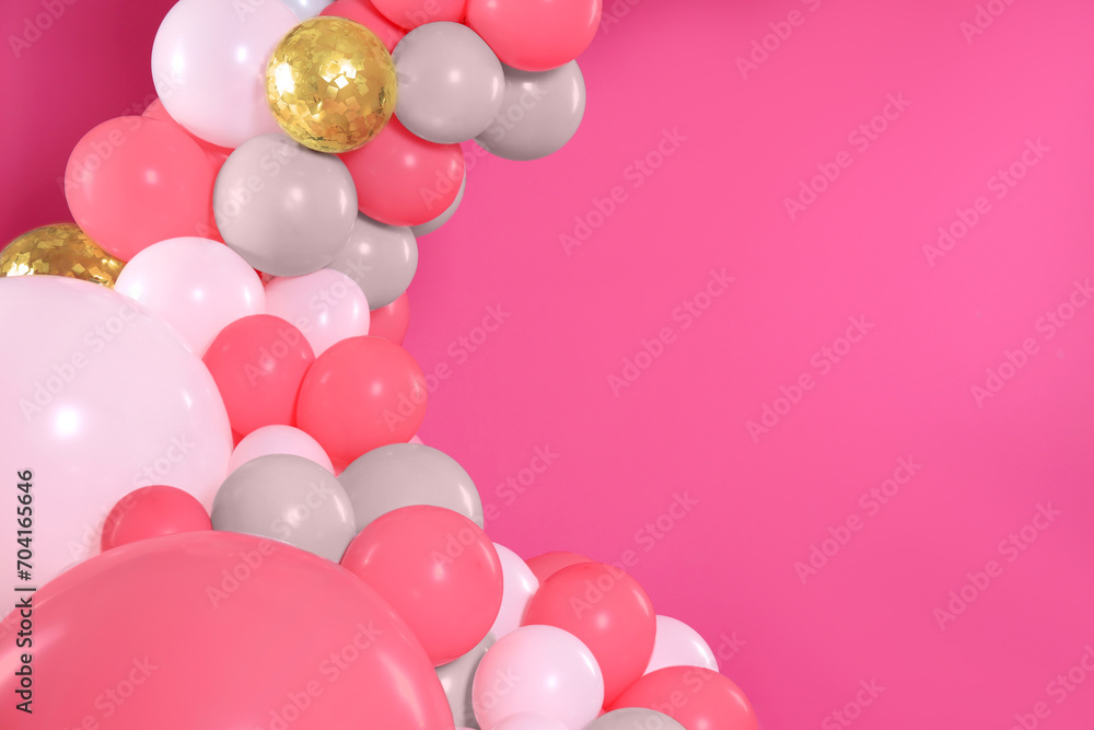 Balloon garland on pink background. Festive decor