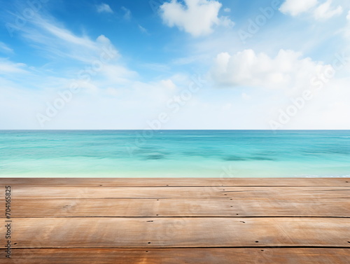 Wooden table with blurred beach and ocean background © duyina1990