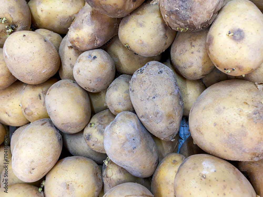Top view of freshly dug potatoes background in the market Top view of freshly dug potatoes background in the market