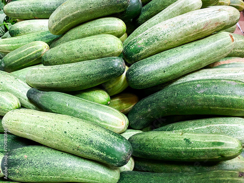 Top view cucumbers, long cucumbers, vegetables harvest, food background, copy space for text