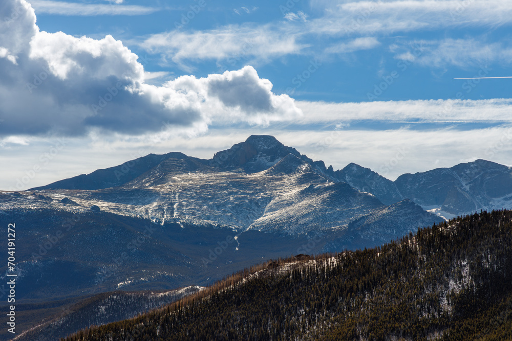 Colorado mountain in the sun with cloudy sky Colorado mountain in the sun with cloudy sky