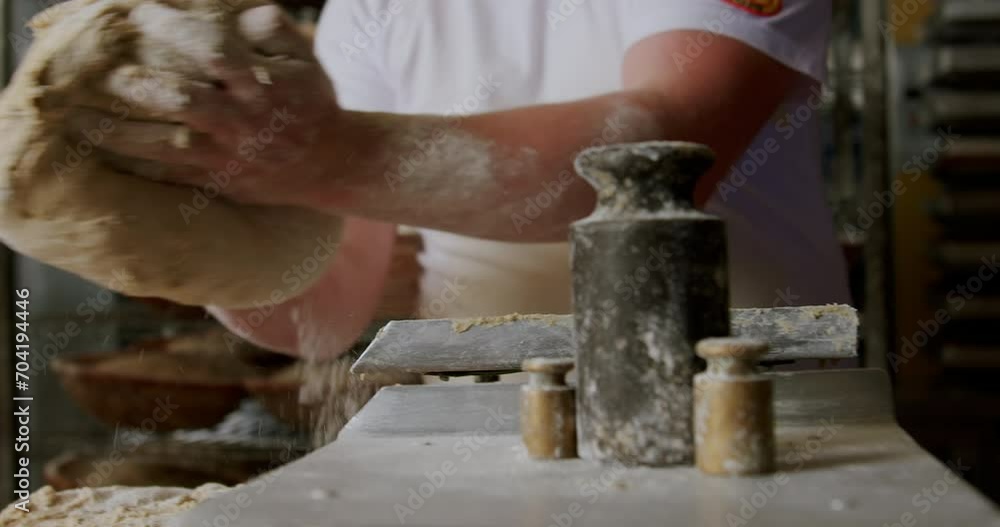 Baker kneading the dough, making bread 4K, the process of making bread dough, healthy home-made breakfasts, bakery and pastries, production of healthy food, traditional regional specialties. Baker kneading the dough, making bread 4K, the process of making bread dough, healthy home-made breakfasts, bakery and pastries, production of healthy food, traditional regional specialties.
