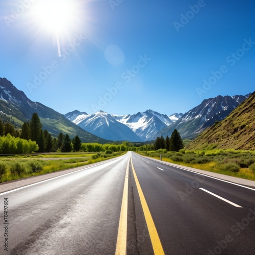 Scenic view of an empty asphalt road through snow-capped mountains © duyina1990