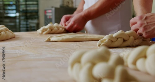 Making traditional challah pastries at a bakery, 4K, healthy home-made breakfasts, bakery and pastries, production of healthy food, traditional regional specialties, traditional Jewish festive bread photo