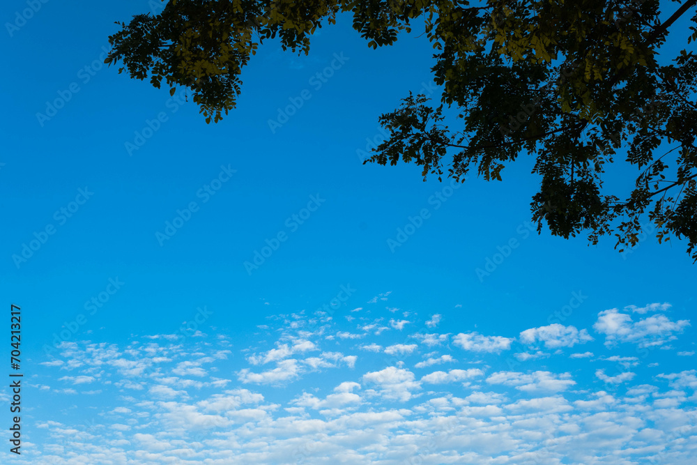 Obraz premium Beautiful sky with clouds and sun on a summer day. Time lapse of clouds above the blue sky with the sun shining. Sky nature background.