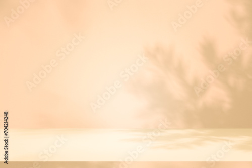 Wall interior autumn background, studio, and backdrops show products. with shadow leaf color beige background for text insertion and presentation of product