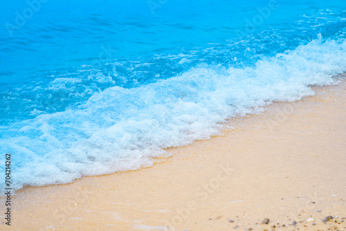 Summer sea natural background blue surface, clear water with ripples and splashes. water waves in sunlight The water surface has waves.