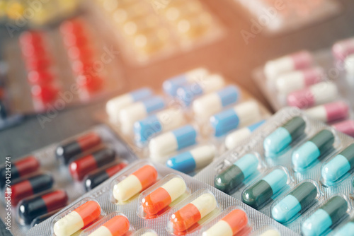 close up pharmaceuticals antibiotics pills medicine in blister packs. colorful antibacterials pills Pharmacy background. capsule pill medicine Antimicrobial drug resistance. Pharmaceutical industry photo