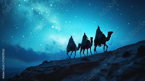 A silhouette of the Three Wise Men traveling on camels along the starlit path to reach Jesus at his birth.