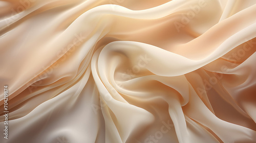A fabric, in shades of white, beige, and salmon, flows elegantly, showcasing its soft folds and silkiness.