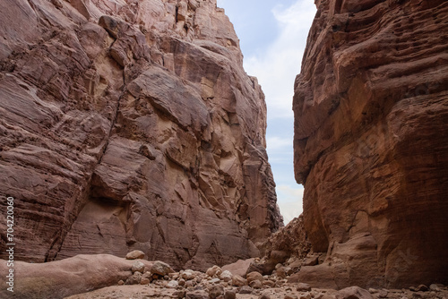 High rocks with beautiful natural patterns at end of the hiking trail in Wadi Numeira gorge in Jordan