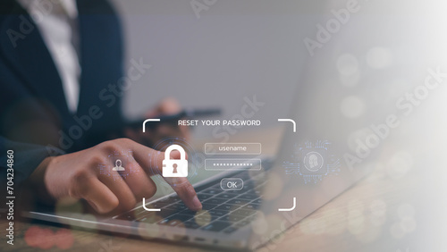  A lock icon, and security code show on the change password page while a business person using a laptop computer. Cyber security technology on websites or apps for data protection. photo