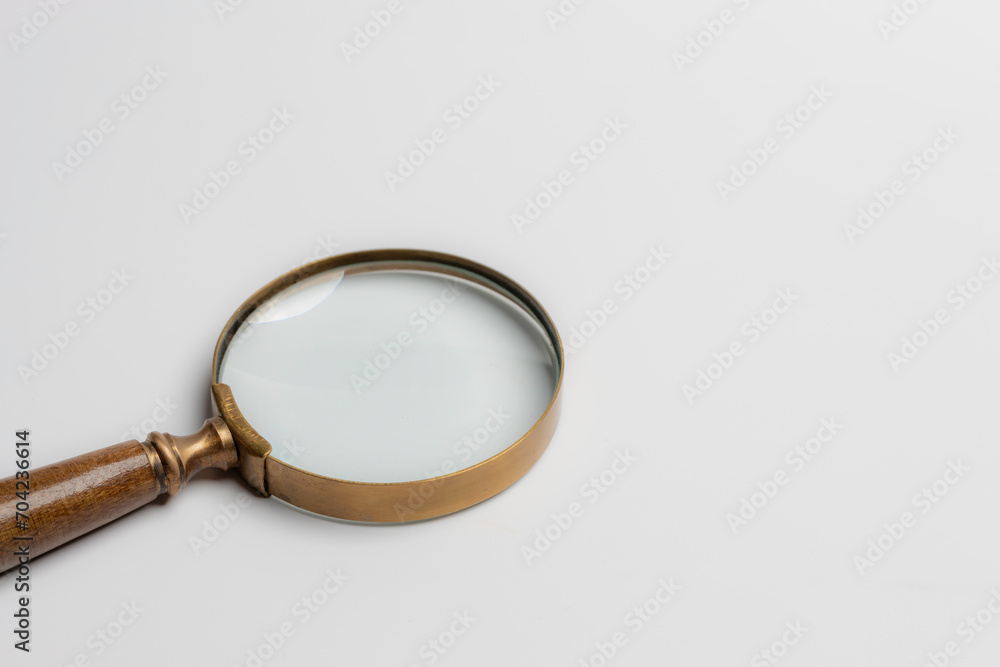magnifier glass for focus business objective on gray background and copy space. Search, goal, strategy, success. magnifier glass for focus business objective on gray background and copy space. Search, goal, strategy, success.