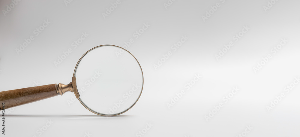 Fototapeta premium magnifier glass for focus business objective on gray background and copy space. Search, goal, strategy, success.