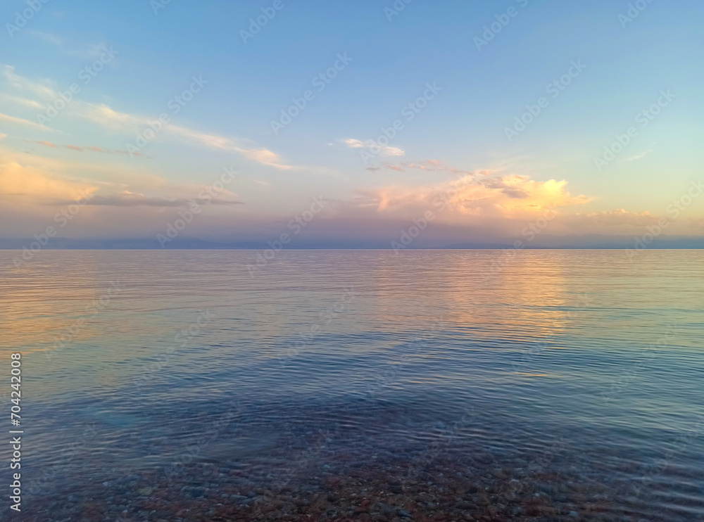 Fototapeta premium Mountain lake, clean transparent water. Coastline. Kyrgyzstan, Lake Issyk-Kul. natural background. Landscape
