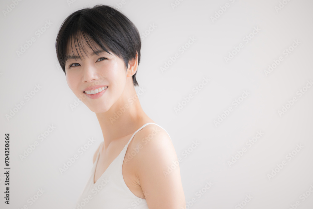 Smiling woman with beautiful bare skin, looking at the camera Smiling woman with beautiful bare skin, looking at the camera