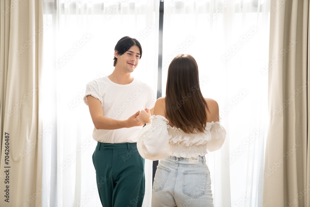 Fototapeta premium Beautiful young people having fun outdoors. Valentine's Day concept. Lovers at home celebrating Valentine's Day.