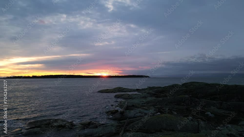 Rocky Ocean Coast, Dramatic Sunrise Sky. Winter Season. Vancouver Island, BC Canada. Rocky Ocean Coast, Dramatic Sunrise Sky. Winter Season. Vancouver Island, BC Canada.