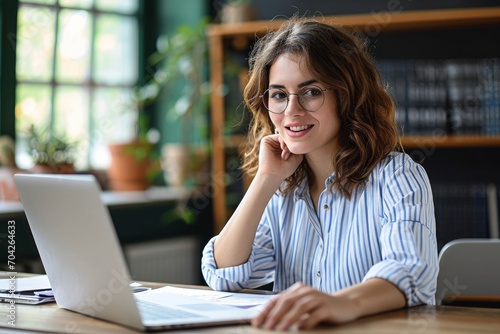 Young happy professional business woman online teacher or tutor sitting at work desk talking to student on video call teaching remote class, leading webinar or distance web meeting, Generative AI  photo