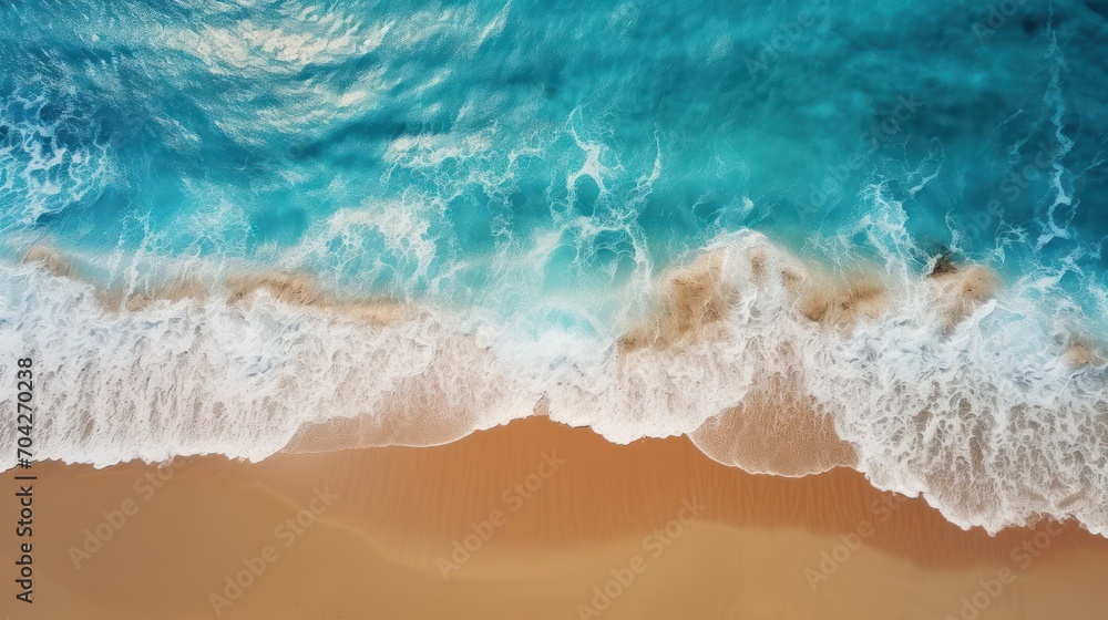 an aerial view of a beach with a wave coming in to the shore and a sandy beach with waves coming in to the shore. an aerial view of a beach with a wave coming in to the shore and a sandy beach with waves coming in to the shore.
