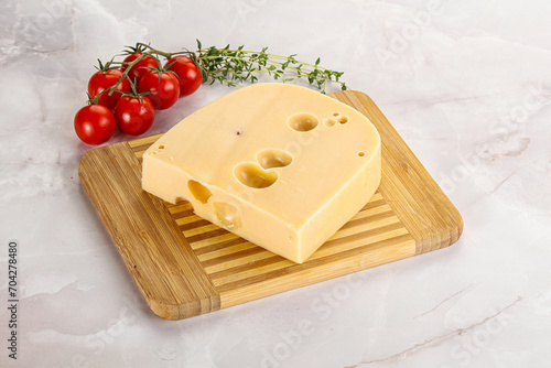 Maasdam cheese brick over board