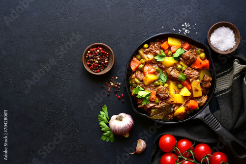 Meat stew with vegetables. Top view with copy space.