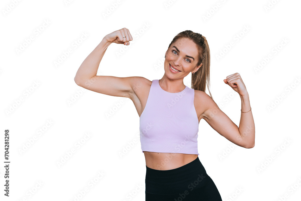 Cheerful girl in sportswear standing at gym shows double biceps looks at camera smiles against transparent background, satisfied by strength, endurance and flexibility. Sporty women. Cheerful girl in sportswear standing at gym shows double biceps looks at camera smiles against transparent background, satisfied by strength, endurance and flexibility. Sporty women.