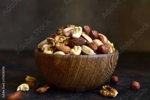 Variety of nuts in a wooden bowl.