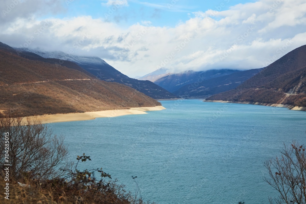 Water reservoirs and mountains in winter. Warm southern winter. Mountains without snow