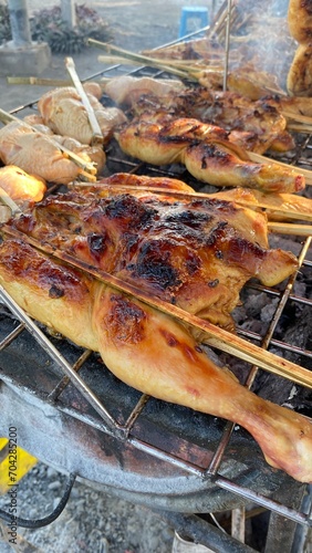 Grilled chicken, eaten hot with tamarind dipping sauce, very delicious.  © Pa