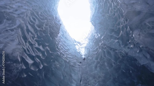 Move through majestic ice cave formation with ice bridge and glacier river in Iceland