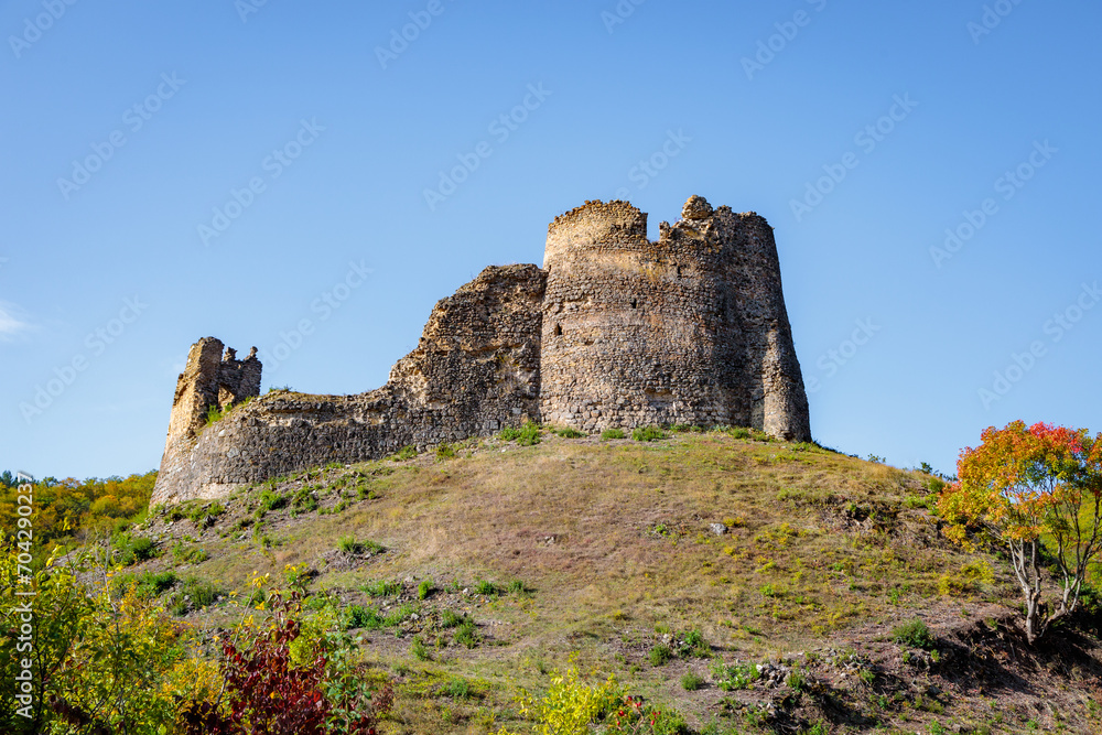 An old ruined fortress on the hill of the mountain