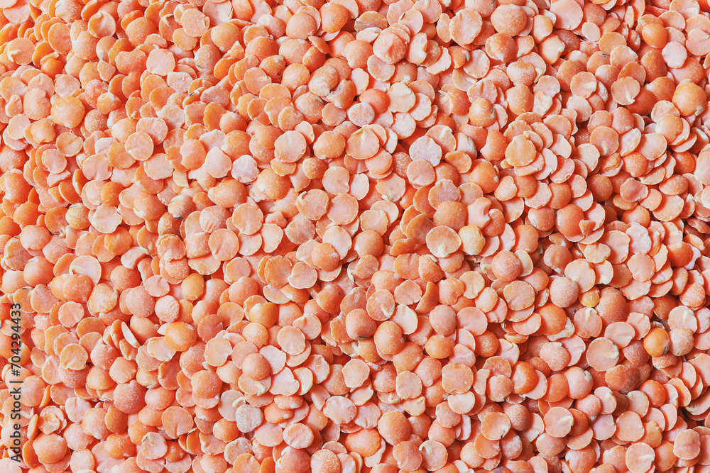 Top view of broken red lentils background Top view of broken red lentils background