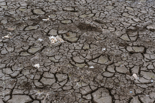 plastic polluted cracked earth background. Global warming, climate change and global warming concept. Environmental pollution