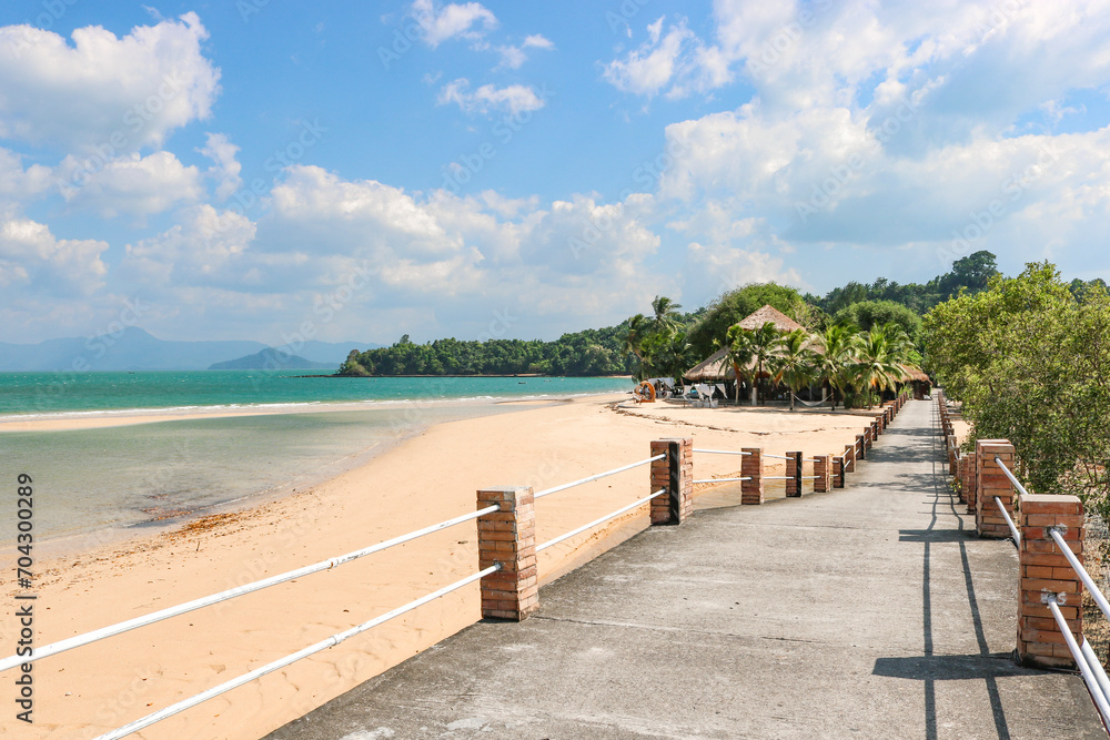 A bridge along the coast leading to a resort on a tropical island. Vacation, travel, relaxation concept. A bridge along the coast leading to a resort on a tropical island. Vacation, travel, relaxation concept.