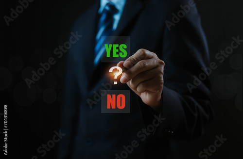 A businessman is deciding between a symbol that is right or wrong, true or false, yes or no. for business decisions