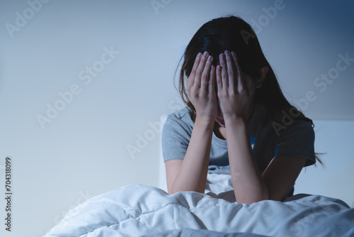 Anxiety disorder on insomnia woman concept, sleepless Woman open eye awakening on the bed at night time can't sleep from symptom of depression diseased.