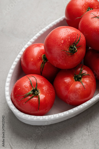 Fresh tomatoes close-up on a white plate. Healthly food